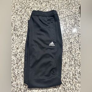Adidas soccer pants with black stripes on the side. Size small in women’s.